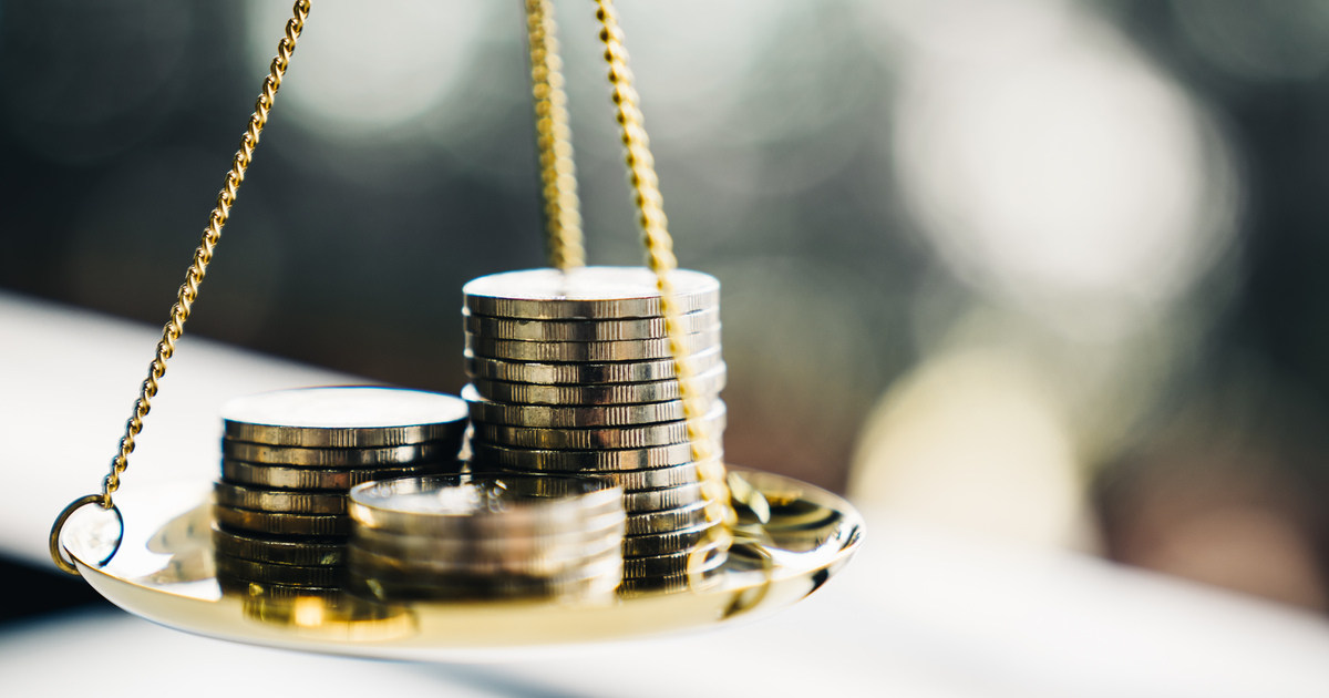 Coins stack with balance scale